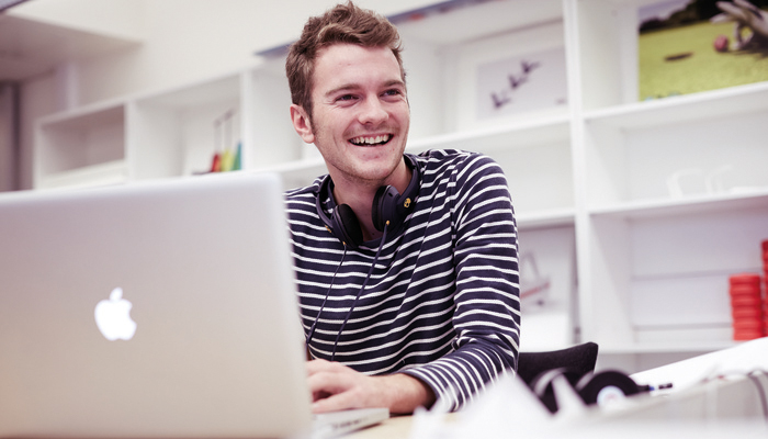 A student working using a laptop