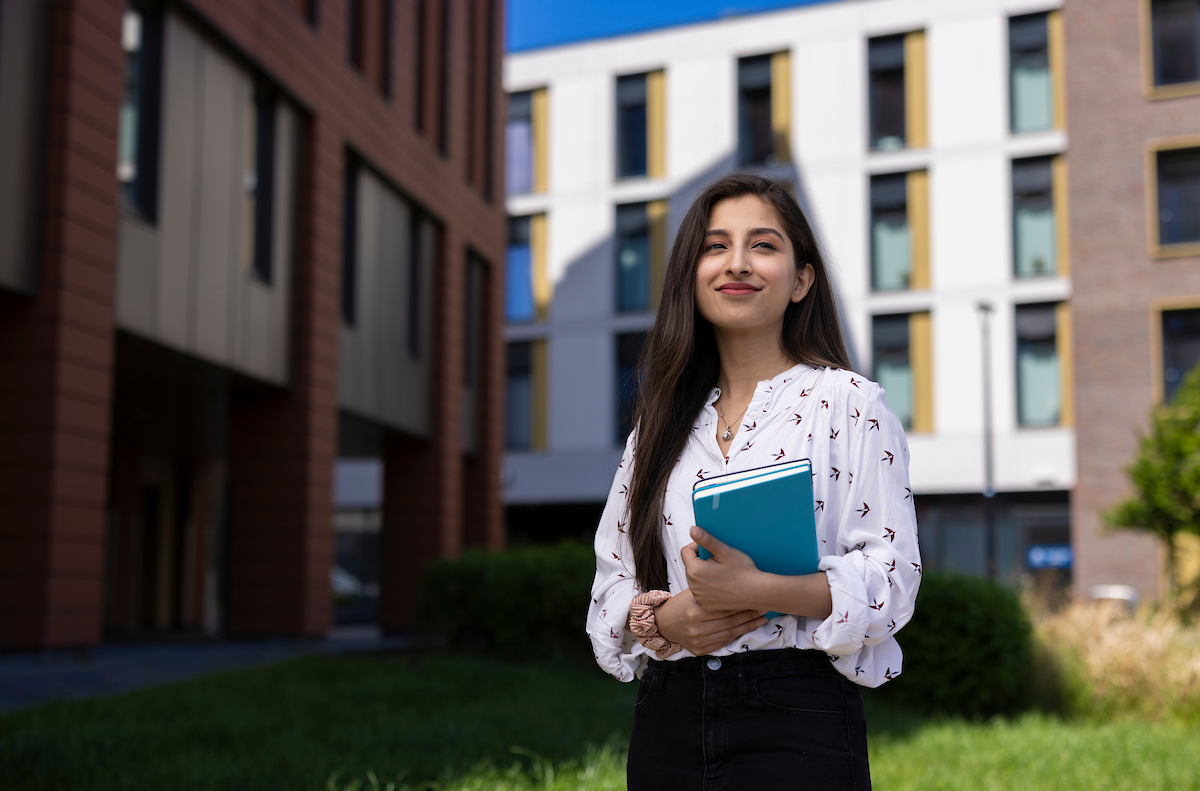 A student with a notebook