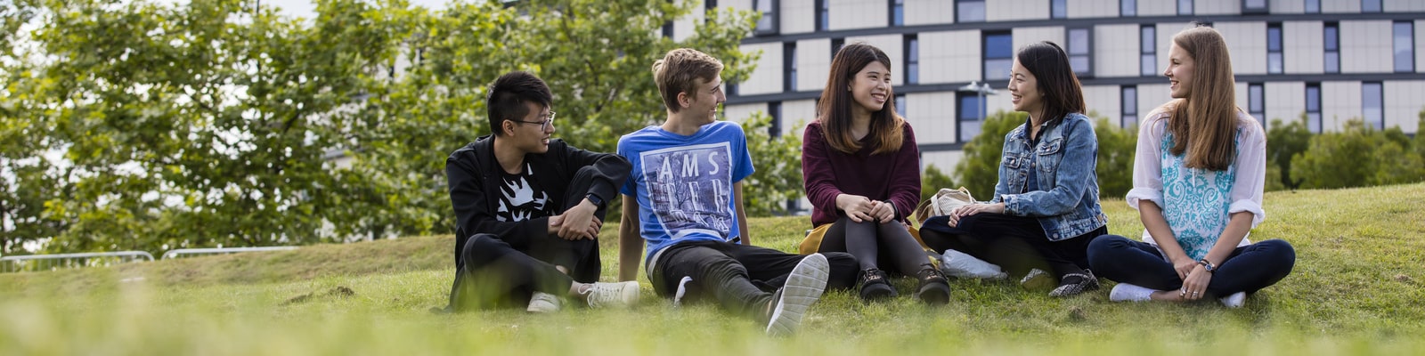 Students sitting on grass