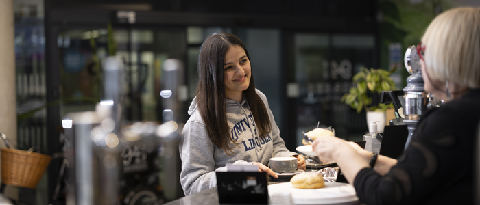 A student being served in Pier Cafe