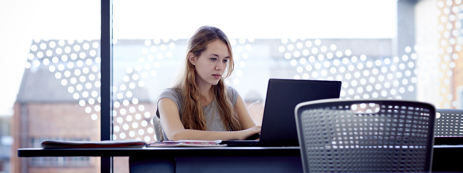 Female student working on a laptop