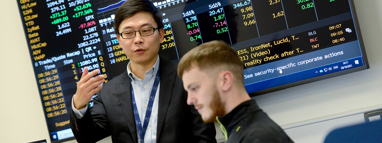 A student and teacher in the Bloomberg Terminal lab