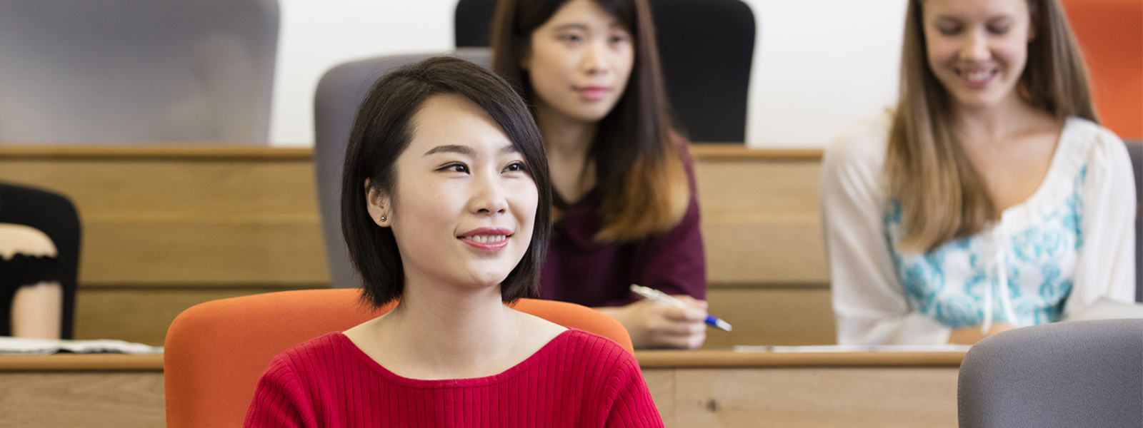 Female student sitting in a University lecture theatre