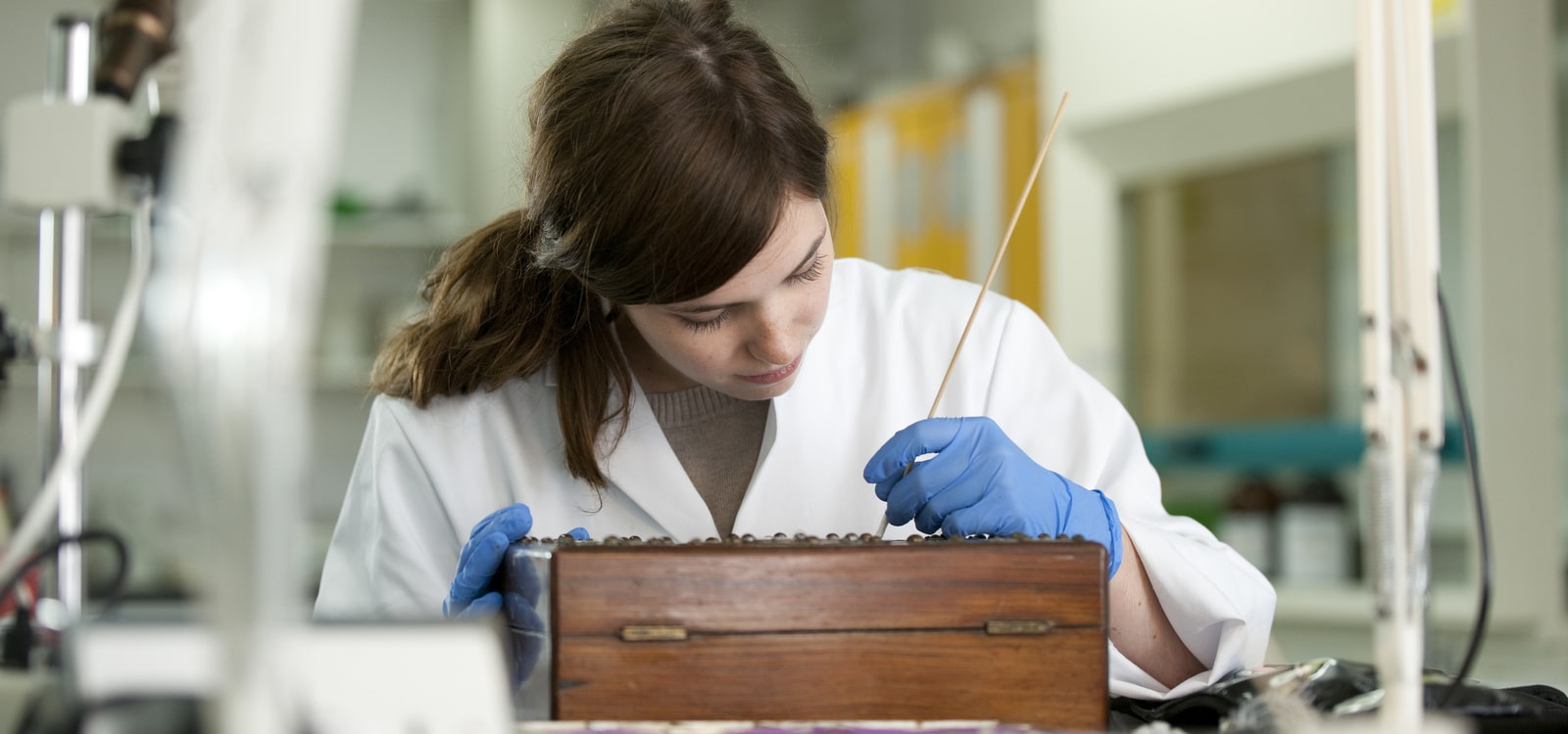 Student carrying out some restorative work on an historic object in the laboratory