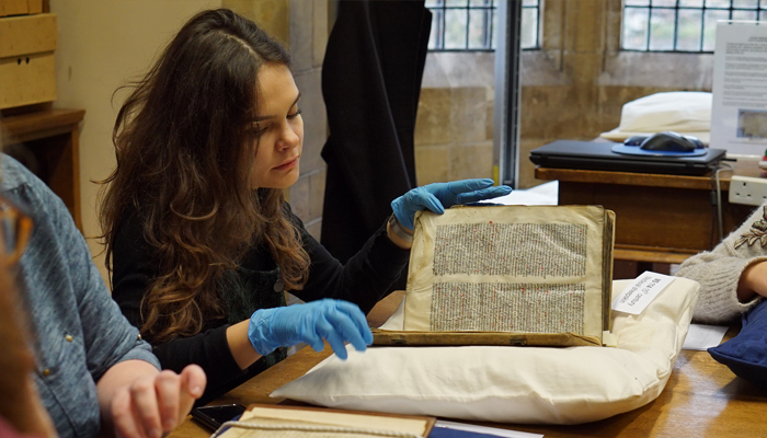 A student examining an historic text