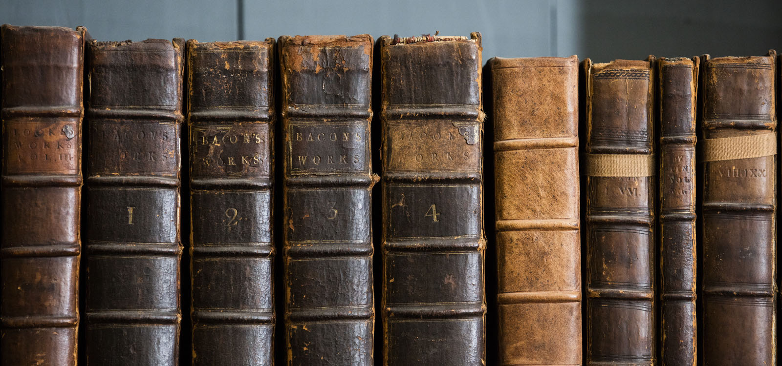 Early print books lined up on a shelf