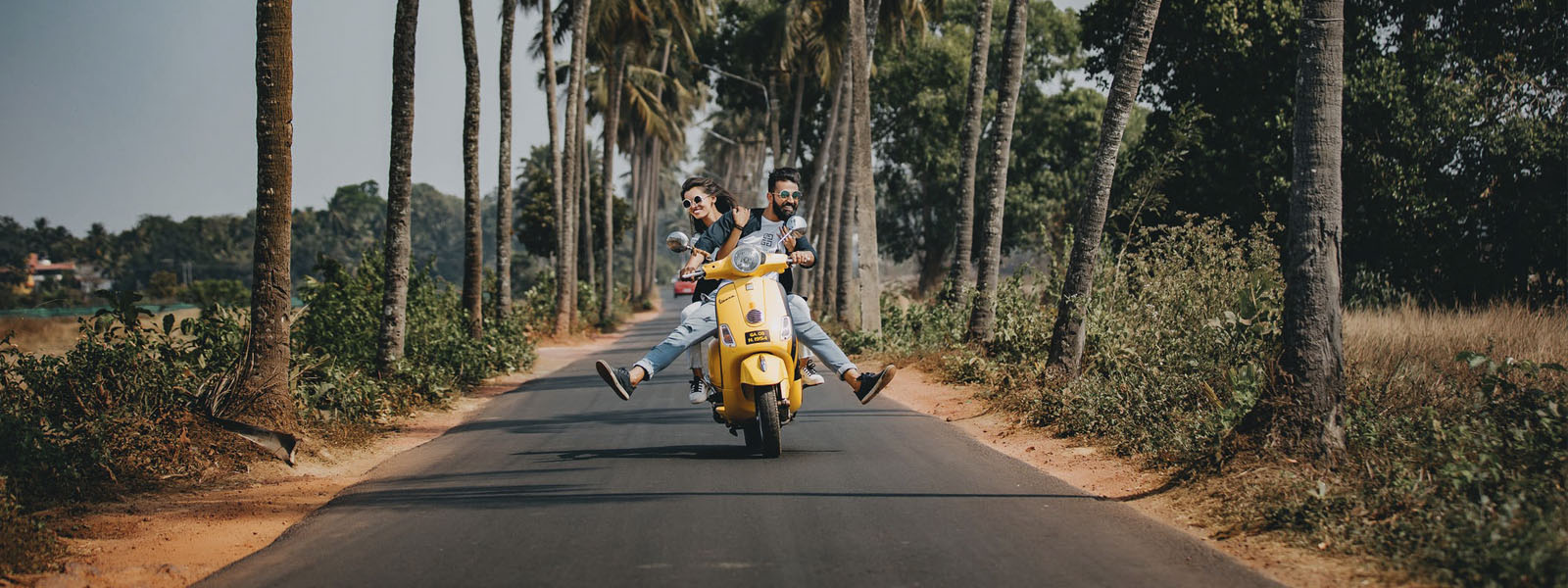 A couple riding on a motorbike 