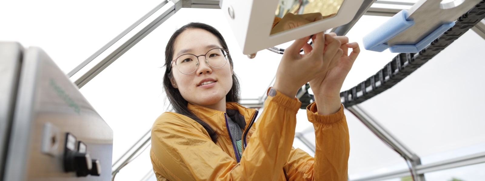 A researcher working on a robotics project at the Lincoln Institute for Agri-food Technology