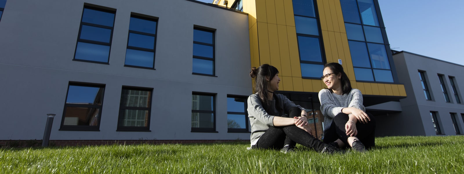 Students sitting on grass