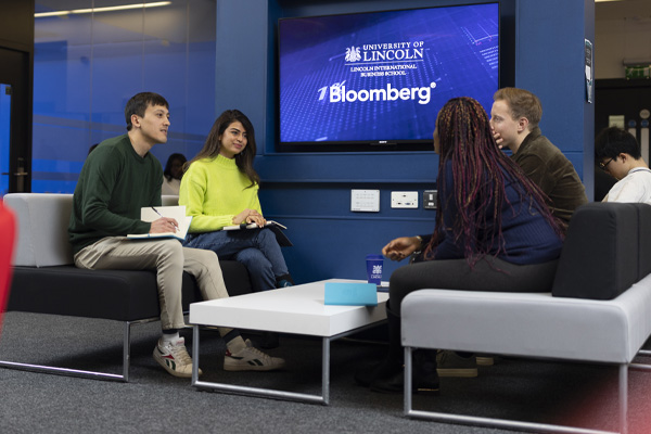 A group of students working together in a seminar room