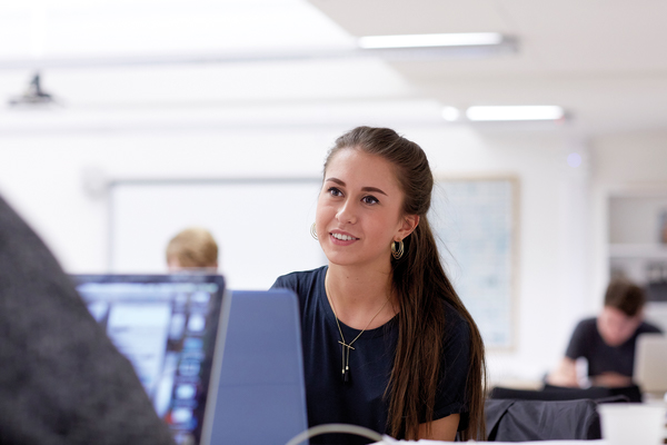 A student working at a laptop