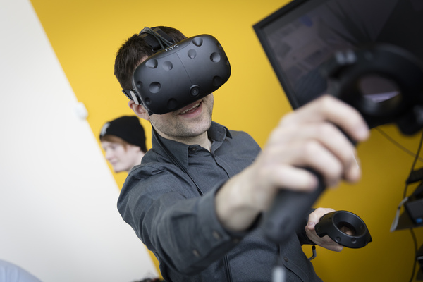 A student using a HTC virtual reality device