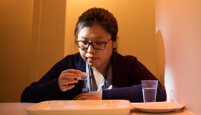 A sensory evaluation tester with a sample