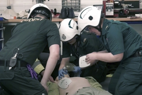 Students and practitioners taking part in an emergency simulation event