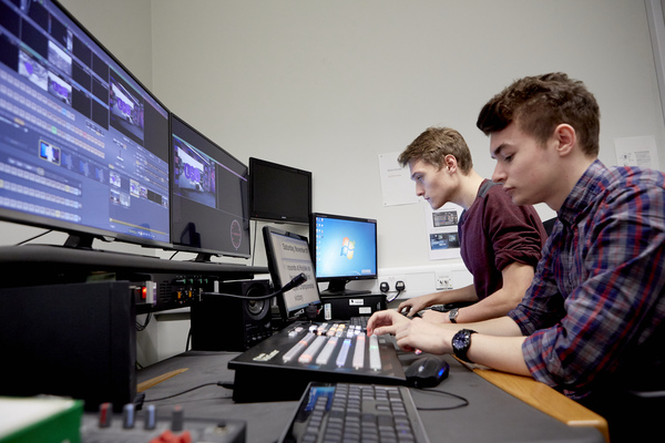 Students working in the Newsroom