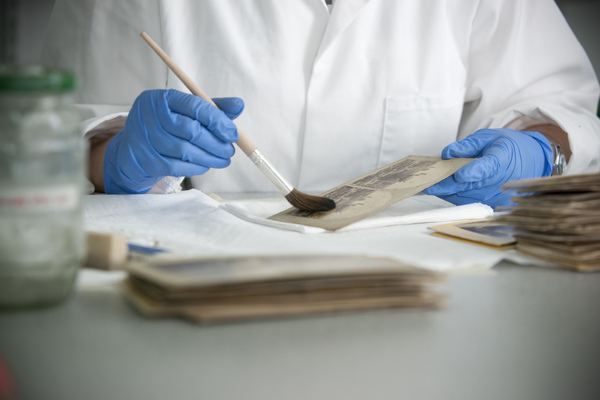 A student working on preserving a book