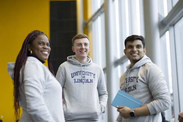 A group of students wearing University of Lincoln hoodies