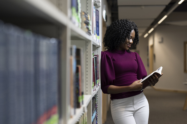 A student reading in the library