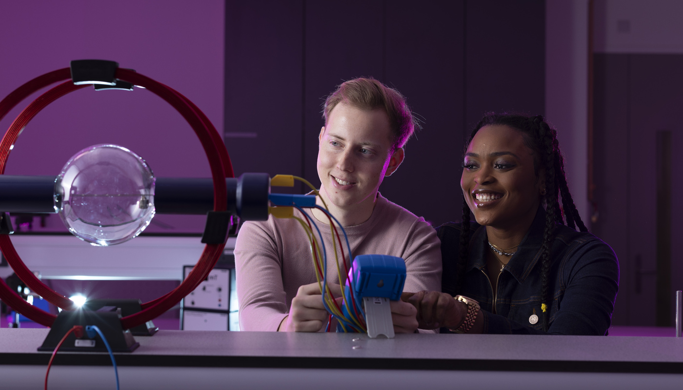 Physics students taking part in a practical session