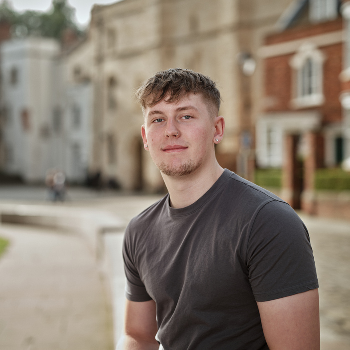 A student sat in a town square