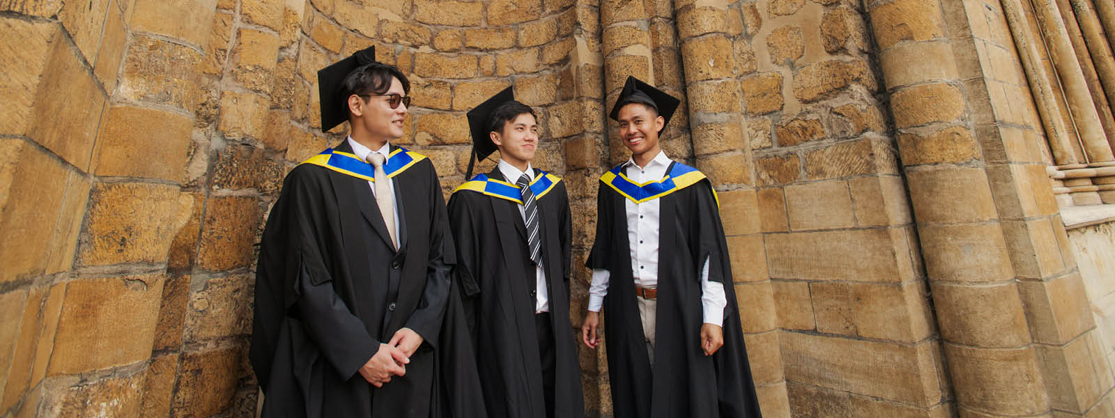 3 students at graduation