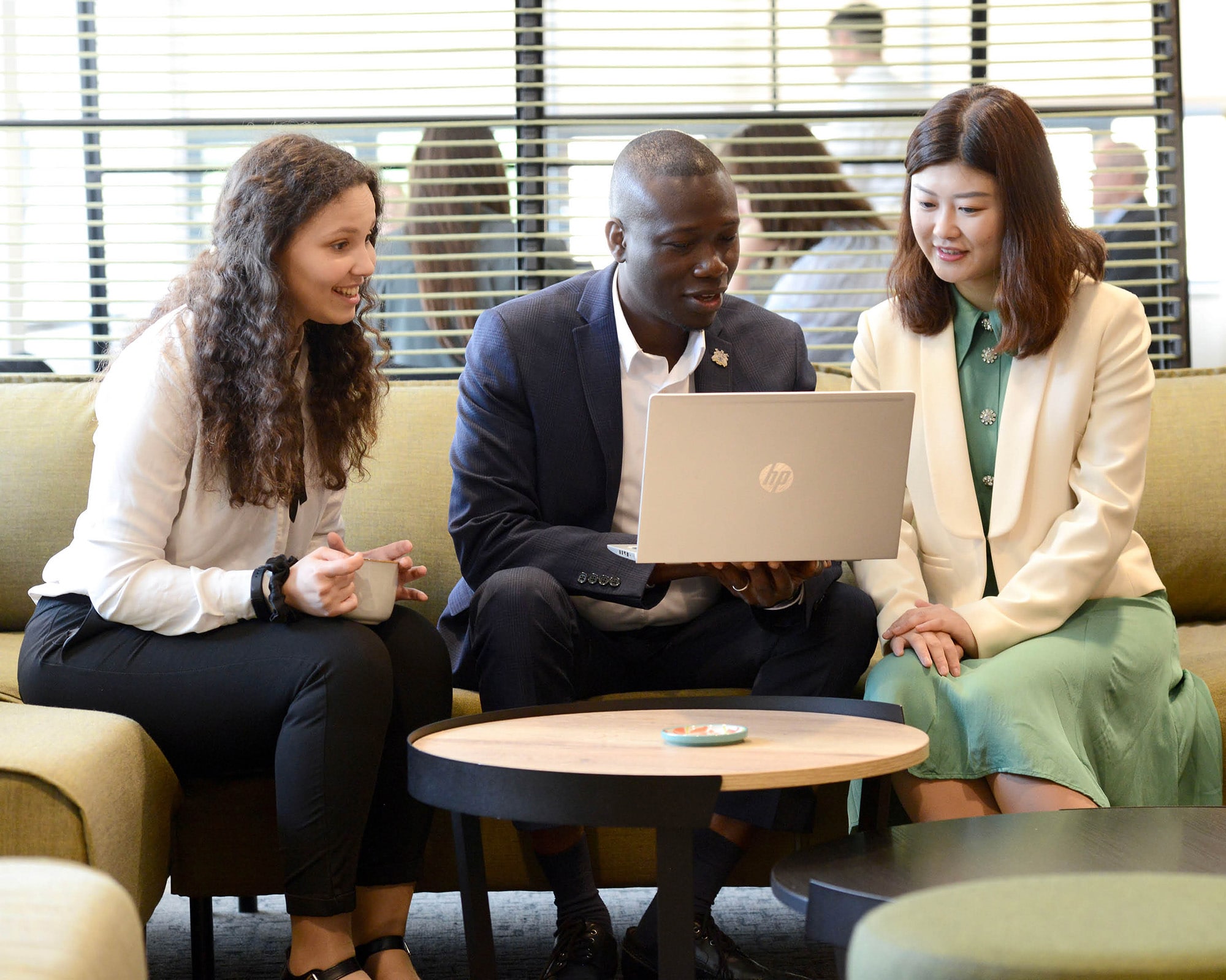 Colleagues looking at a laptop