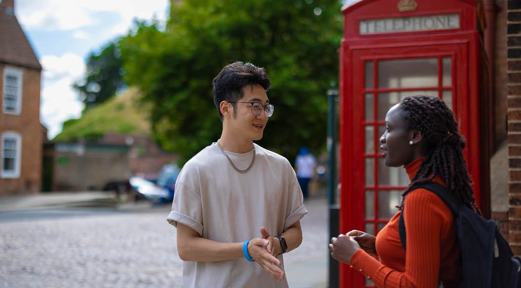 Two students in the bailgate area