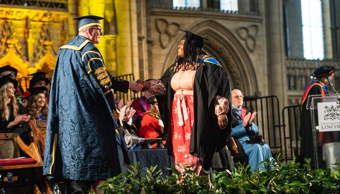 A student graduating at Lincoln Cathedral