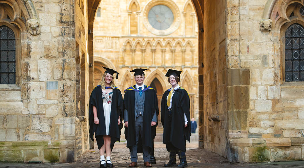Three students outside Lincoln Cathedral