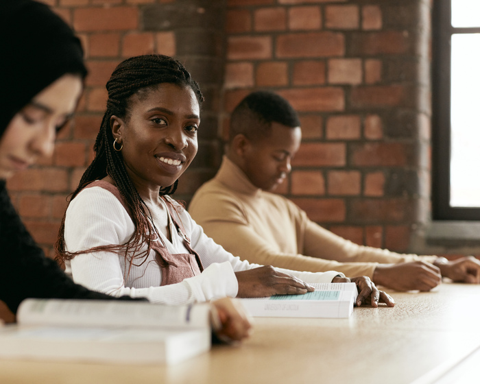 Students at table with textbooks