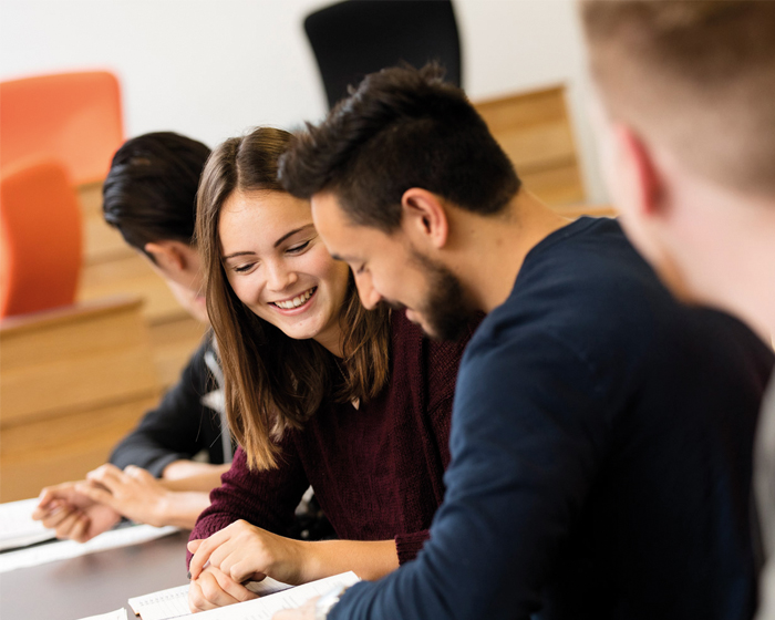 Two students working together at a desk