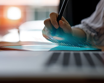 Person using a tablet and stylus pen