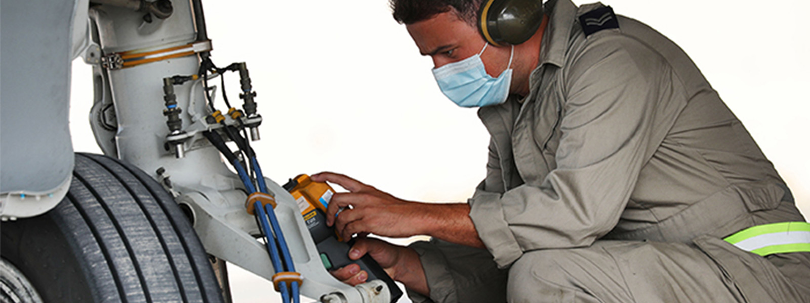 Someone repairing an aircraft wheel