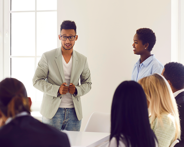 Group of people in a meeting chatting