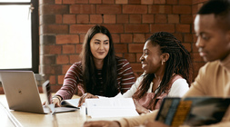 Students sitting in the library together