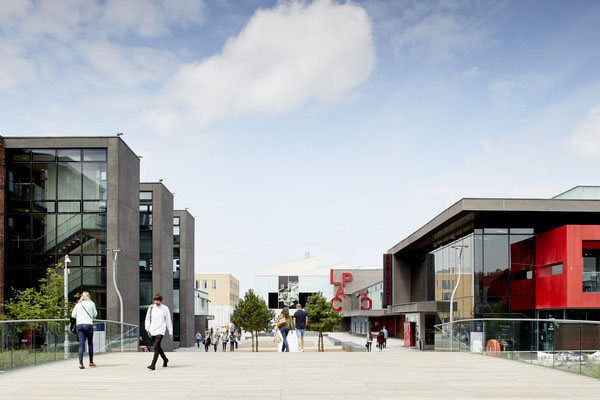 a view of campus going past the library