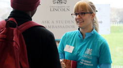 Student ambassador chatting with a guest at an Open Day
