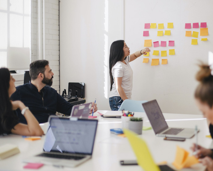 A group of peope talking in a meeting room