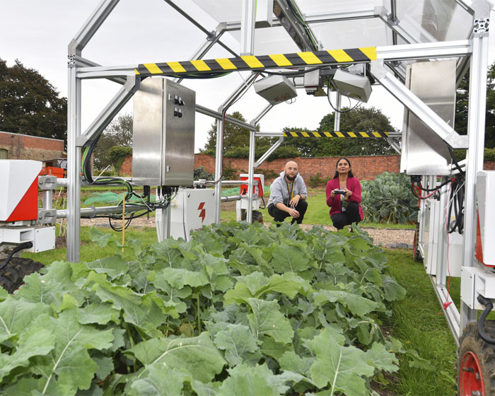 Academics working with an agri-tech robot