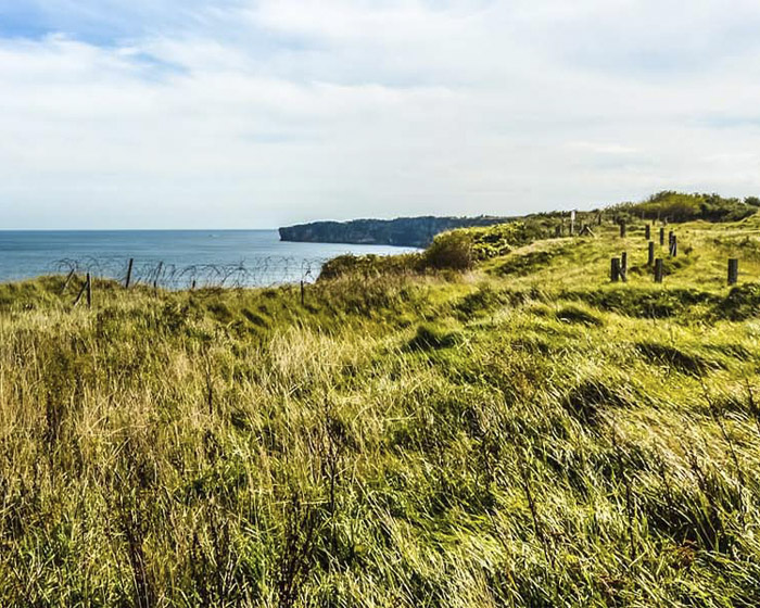 A coastline with grass and cliffs