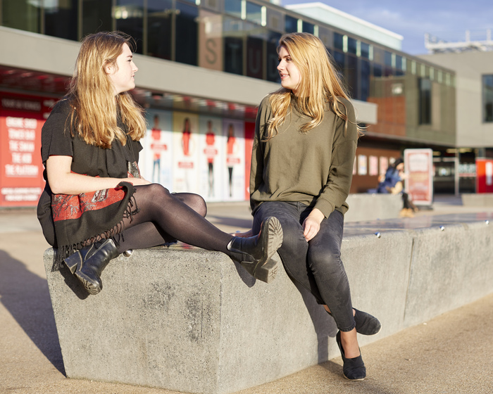 Two students chatting outside