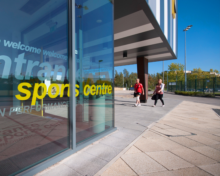 Exterior of the University Sports Centre on s sunny day with clear blue sky