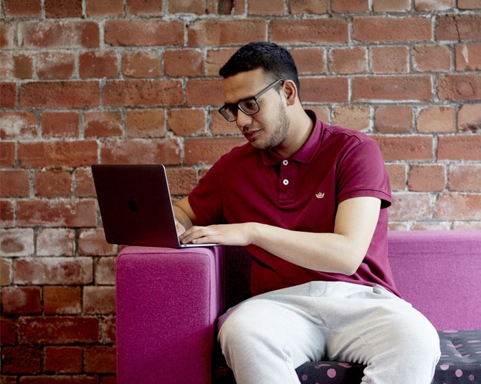 A student working on a laptop in the library