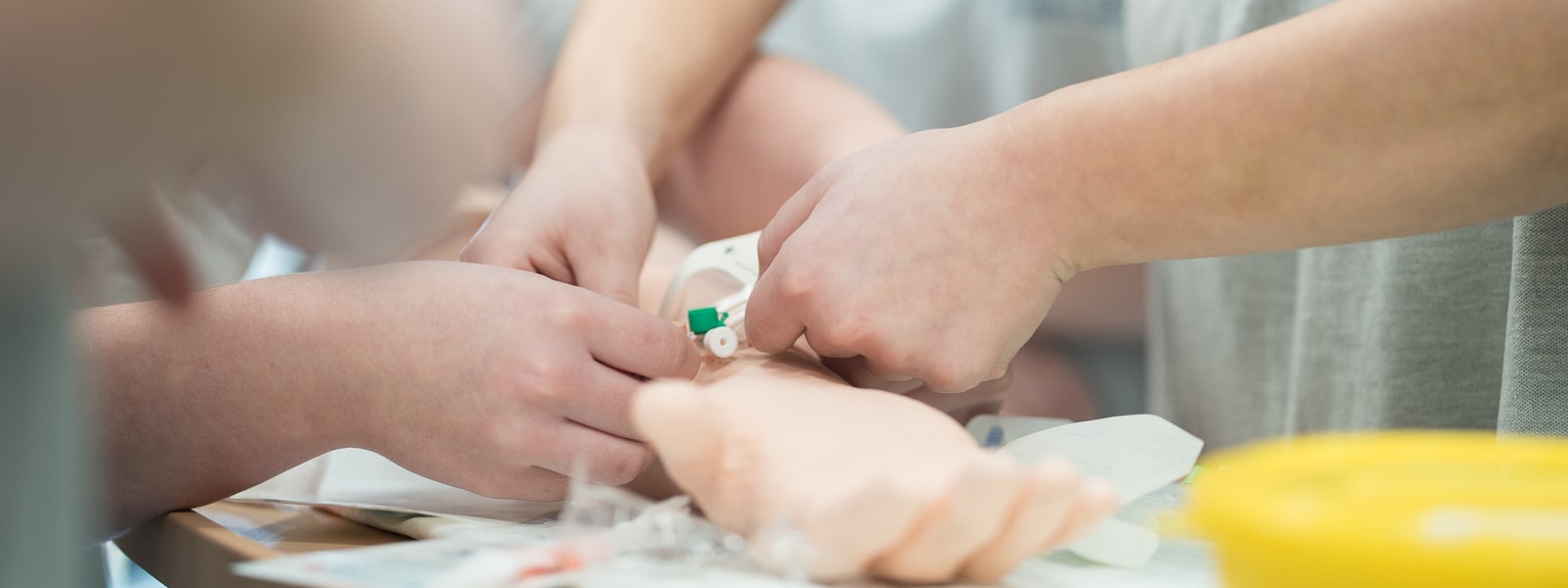 Hands putting in an IV