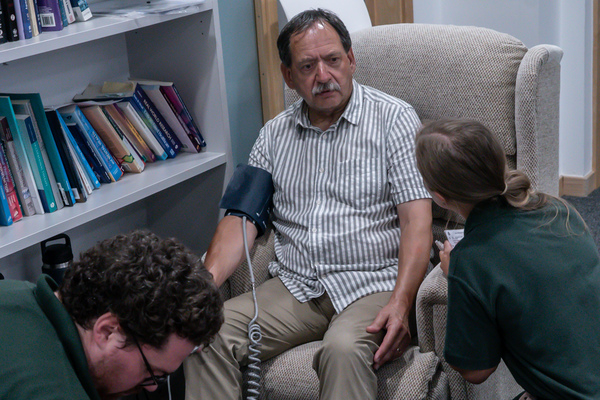 A man being tested for blood pressure