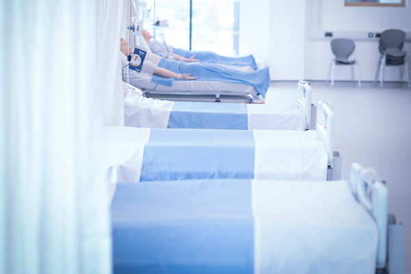 A row of empty hospital beds
