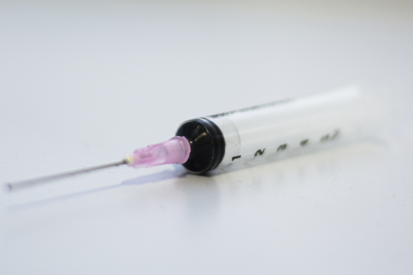 A syringe laid on its side